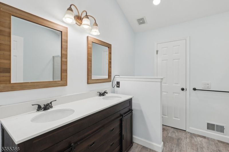 Bathroom, Dual Sink Vanities, Interior, Recessed Lighting, Wood Texture Flooring
