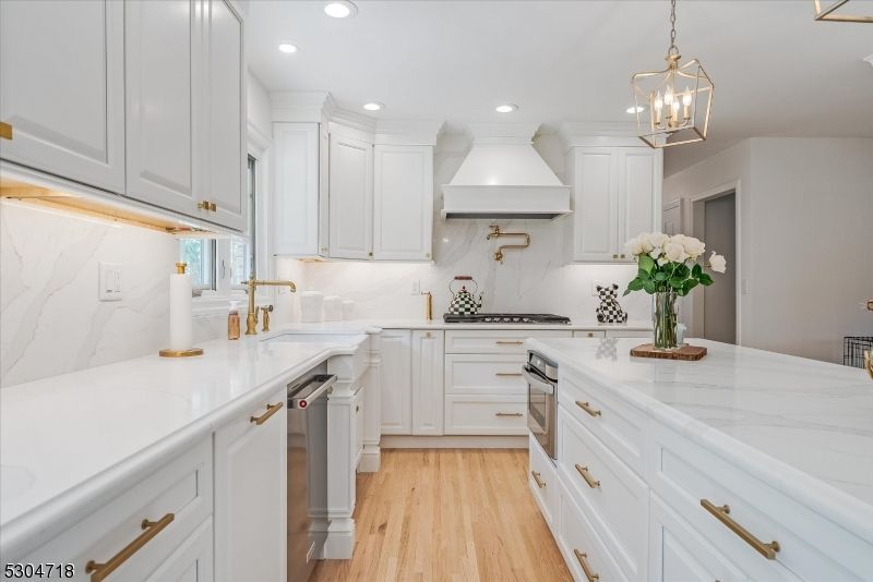 Interior, Kitchen, Marble Walls, Pendant Lights, Recessed Lighting, Stainless Steel Appliances, Wood Texture Flooring