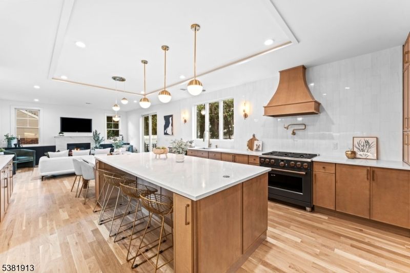 Dining room, Fireplace, Interior, Kitchen, Living room, Pendant Lights, Recessed Lighting, Stainless Steel Appliances, Wood Texture Flooring