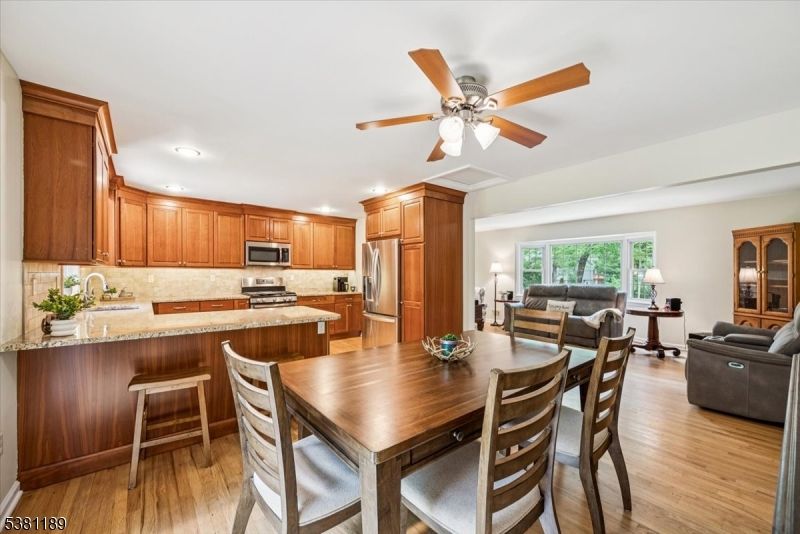 Dining room, Interior, Kitchen, Living room, Recessed Lighting, Stainless Steel Appliances, Wood Texture Flooring