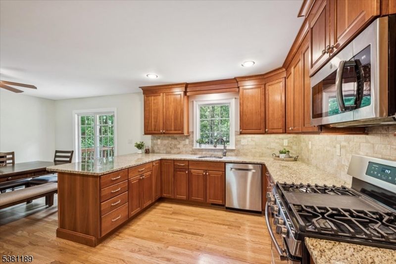 Dining room, Interior, Kitchen, Recessed Lighting, Stainless Steel Appliances, Wood Texture Flooring