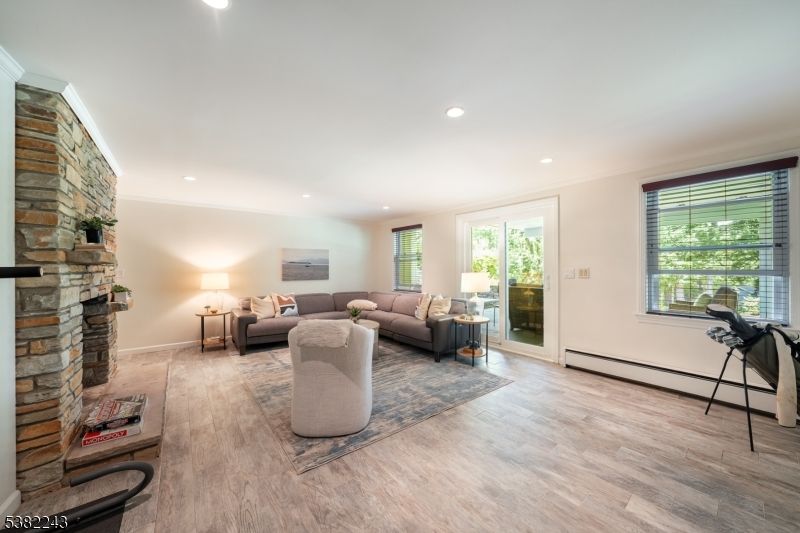 Fireplace, Interior, Living room, Recessed Lighting, Stone Walls, Wood Texture Flooring