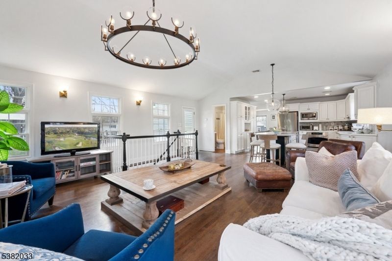 Chandelier, Dining room, Interior, Kitchen, Living room, Pendant Lights, Recessed Lighting, Stainless Steel Appliances, Wood Texture Flooring
