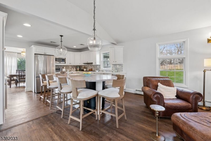 Dining room, Interior, Kitchen, Pendant Lights, Recessed Lighting, Stainless Steel Appliances, Wood Texture Flooring