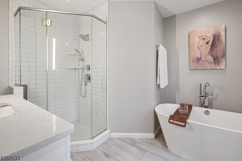 Bathroom, Free Standing Baths, Glass Shower, Interior, Recessed Lighting, Wood Texture Flooring