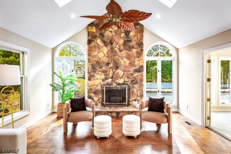 Fireplace, Interior, Recessed Lighting, Stone Walls, Water, Wood Texture Flooring