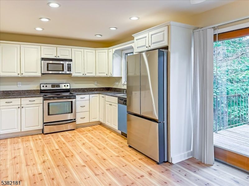 Interior, Kitchen, Recessed Lighting, Stainless Steel Appliances, Wood Texture Flooring