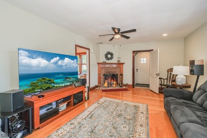 Fireplace, Interior, Living room, Recessed Lighting, Water, Wood Texture Flooring