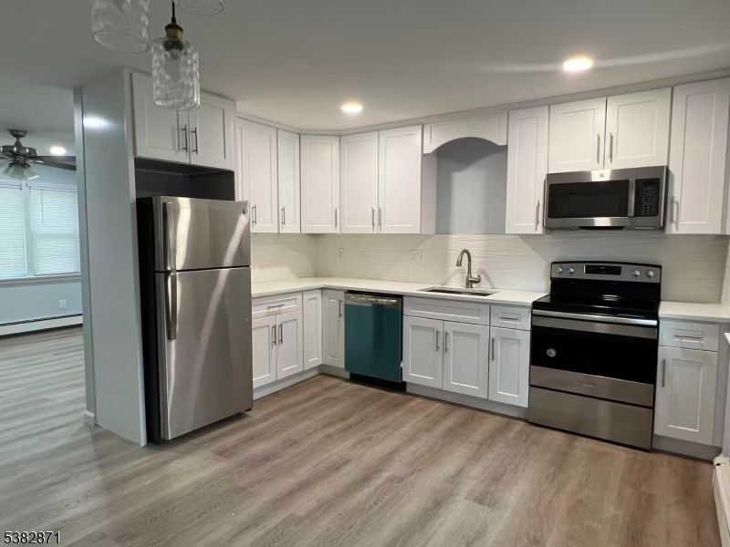 Interior, Kitchen, Recessed Lighting, Stainless Steel Appliances, Wood Texture Flooring