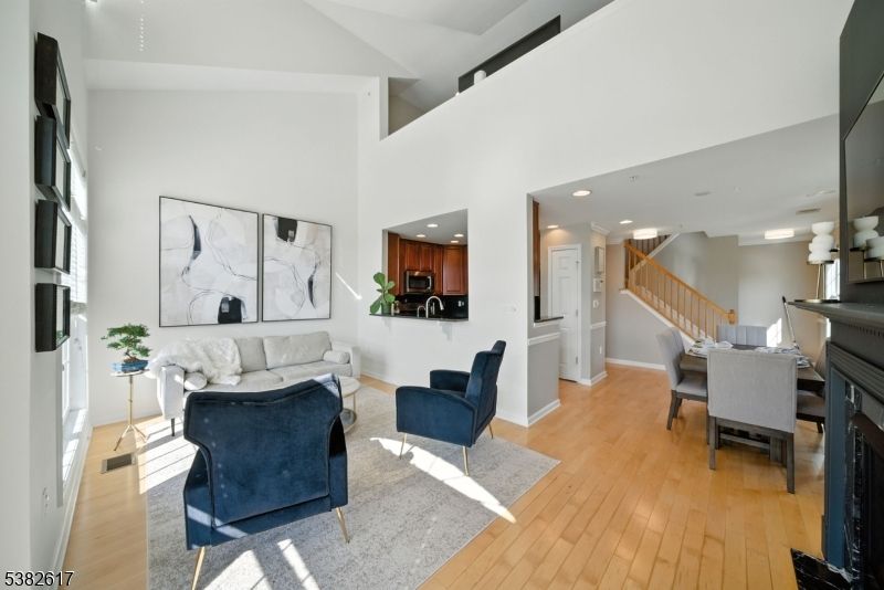 Dining room, Fireplace, Interior, Living room, Recessed Lighting, Wood Texture Flooring
