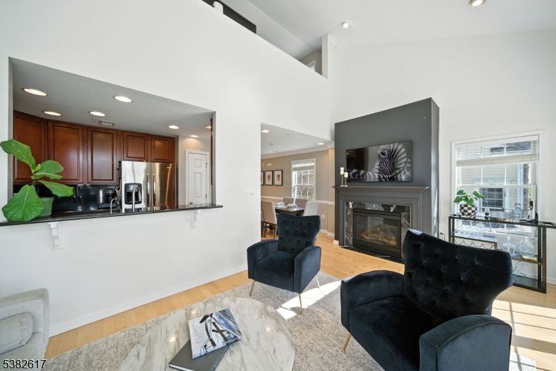 Fireplace, Interior, Kitchen, Living room, Recessed Lighting, Stainless Steel Appliances, Wood Texture Flooring