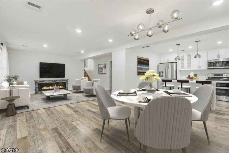 Dining room, Fireplace, Interior, Kitchen, Living room, Pendant Lights, Recessed Lighting, Stainless Steel Appliances, Wood Texture Flooring