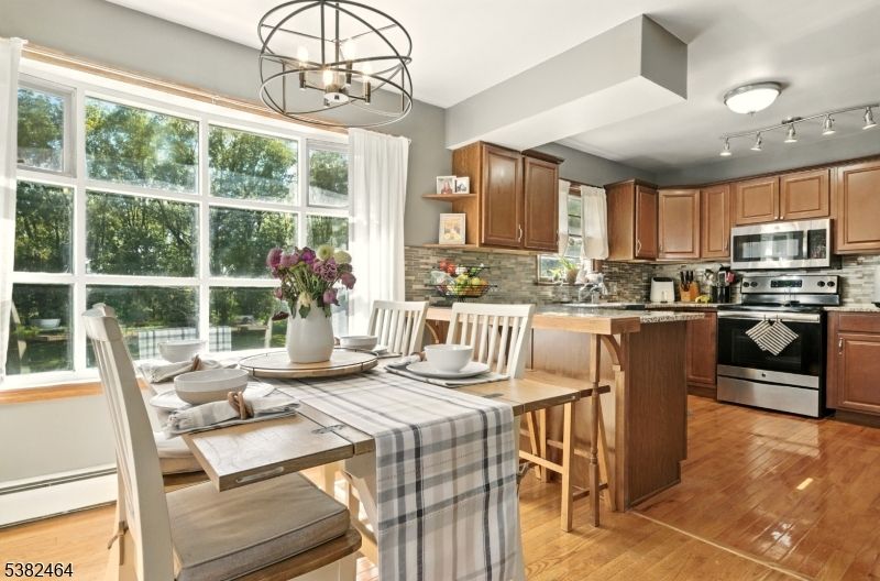 Dining room, Interior, Kitchen, Pendant Lights, Stainless Steel Appliances, Wood Texture Flooring