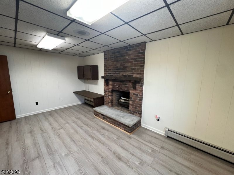 Fireplace, Interior, Recessed Lighting, Stone Walls, Wood Texture Flooring