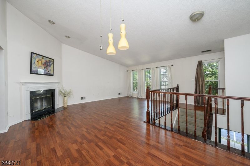 Empty room, Fireplace, Interior, Pendant Lights, Wood Texture Flooring