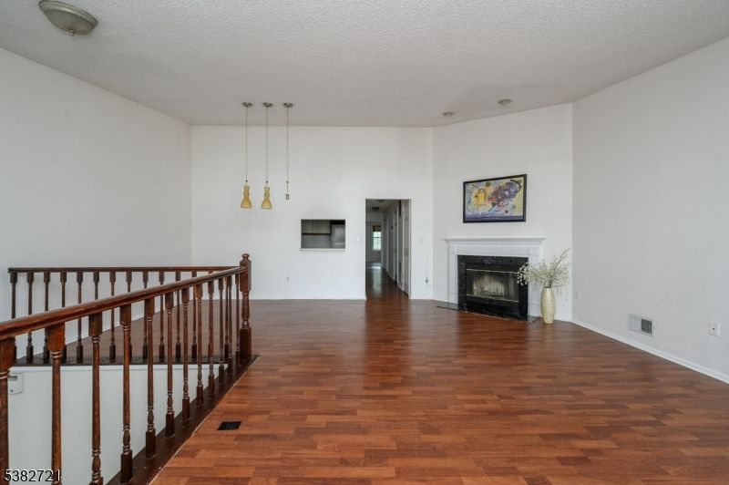 Empty room, Fireplace, Interior, Pendant Lights, Wood Texture Flooring