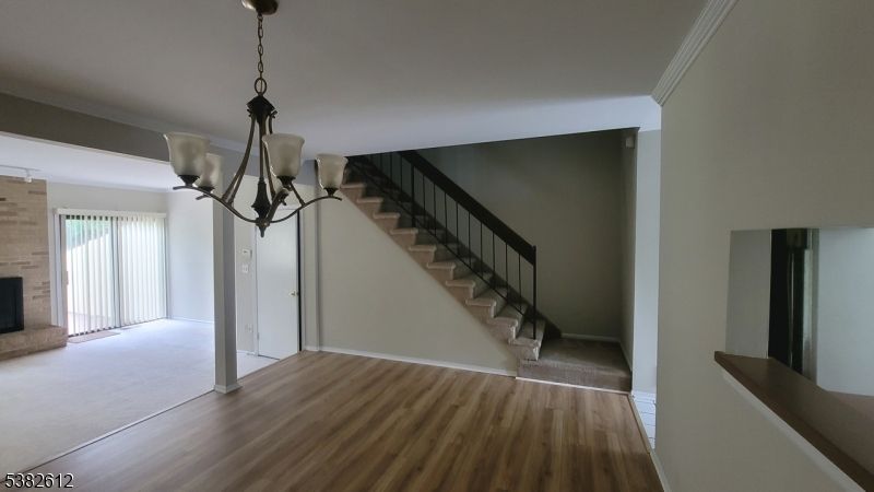 Chandelier, Empty room, Fireplace, Interior, Pendant Lights, Wood Texture Flooring