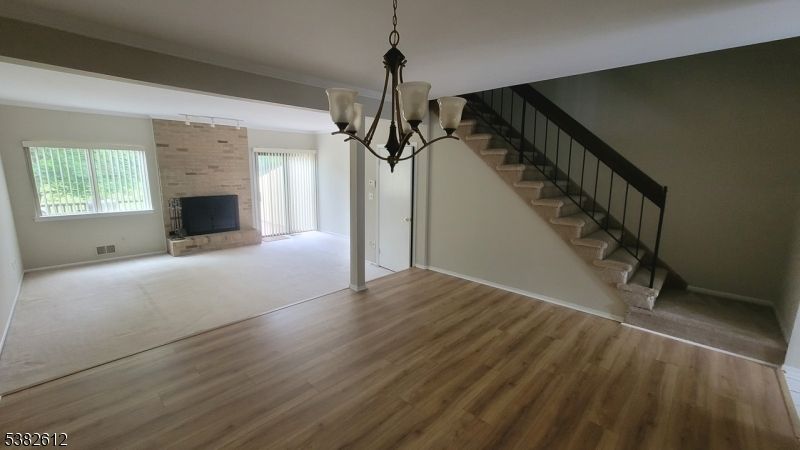 Chandelier, Empty room, Fireplace, Interior, Stone Walls, Wood Texture Flooring