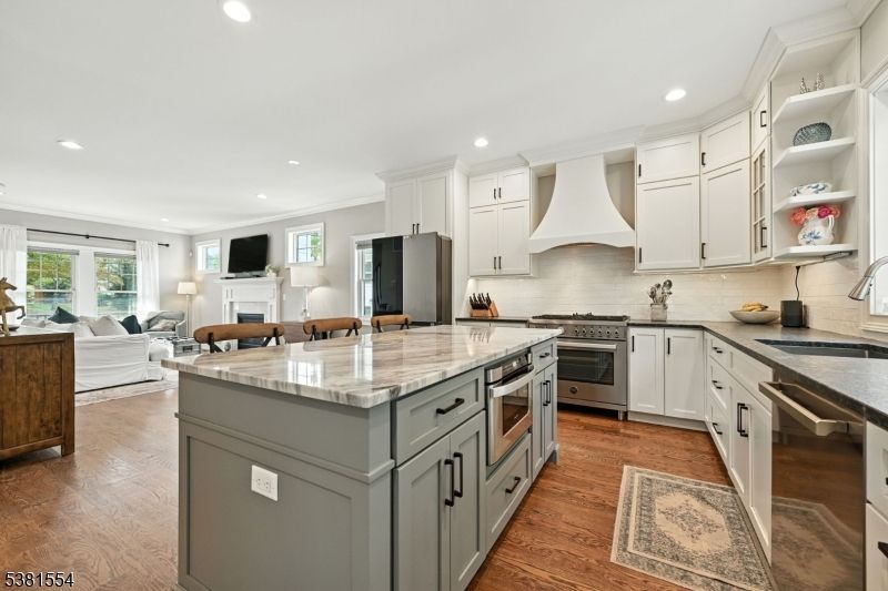 Fireplace, Interior, Kitchen, Living room, Recessed Lighting, Stainless Steel Appliances, Wood Texture Flooring