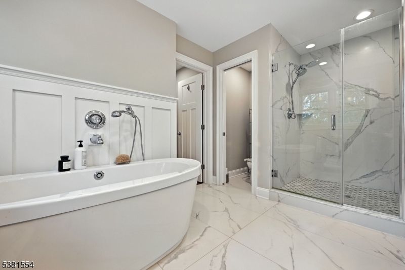 Bathroom, Free Standing Baths, Glass Shower, Interior, Marble, Marble Walls, Recessed Lighting