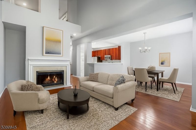 Chandelier, Dining room, Fireplace, Interior, Living room, Recessed Lighting, Wood Texture Flooring