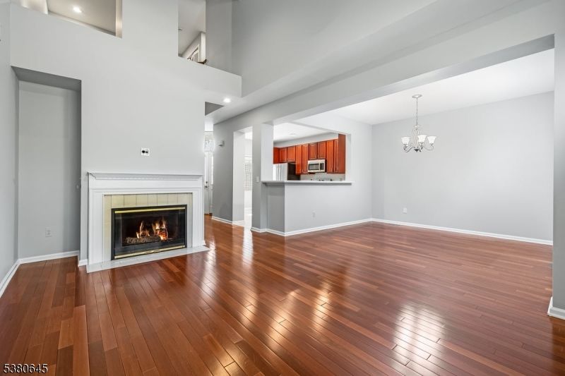Chandelier, Empty room, Fireplace, Interior, Recessed Lighting, Wood Texture Flooring
