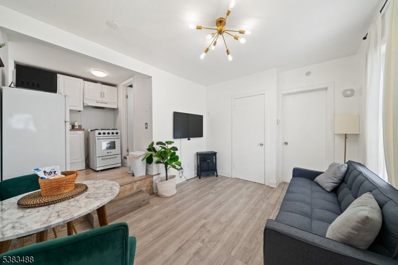 Interior, Kitchen, Pendant Lights, Washer, Wood Texture Flooring
