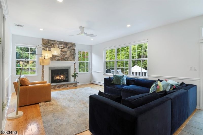Fireplace, Interior, Living room, Recessed Lighting, Stone Walls, Wood Texture Flooring