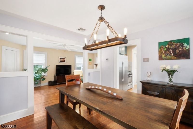 Chandelier, Dining room, Interior, Kitchen, Recessed Lighting, Stainless Steel Appliances, Wood Texture Flooring