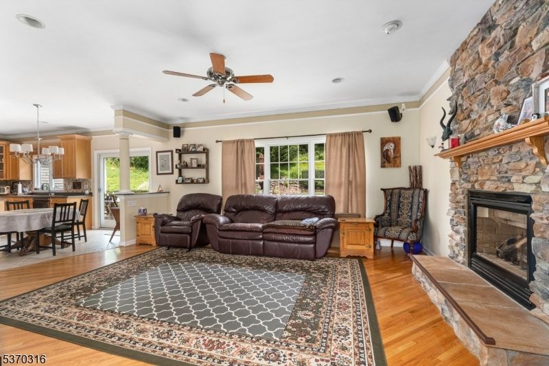 Dining room, Fireplace, Interior, Living room, Pendant Lights, Recessed Lighting, Stone Walls, Wood Texture Flooring