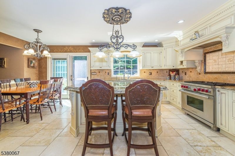 Chandelier, Dining room, Interior, Kitchen, Pendant Lights, Recessed Lighting, Stainless Steel Appliances