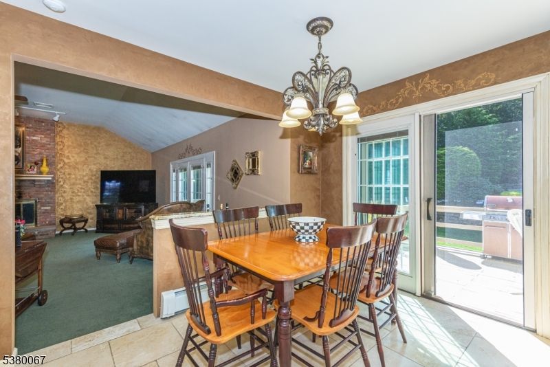 Chandelier, Dining room, Fireplace, Interior, Living room, Stone Walls, Wooden Beams