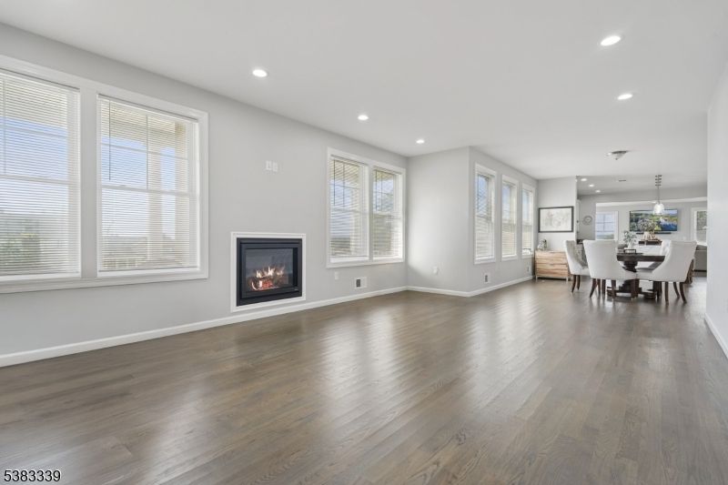 Dining room, Empty room, Fireplace, Interior, Pendant Lights, Recessed Lighting, Wood Texture Flooring