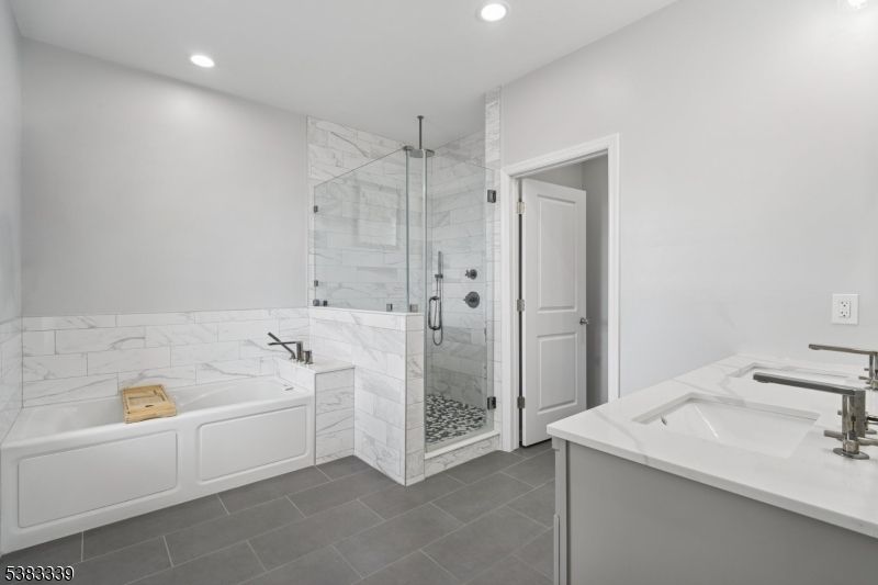 Bathroom, Dual Sink Vanities, Glass Shower, Interior, Marble Walls, Recessed Lighting