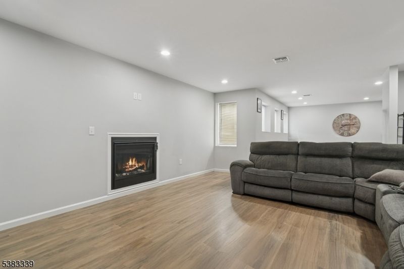 Fireplace, Interior, Living room, Recessed Lighting, Wood Texture Flooring