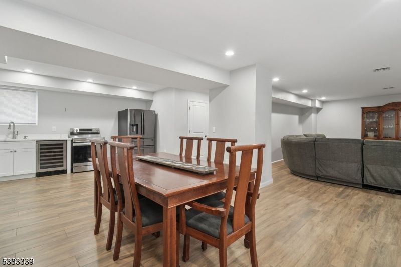 Dining room, Interior, Kitchen, Living room, Recessed Lighting, Stainless Steel Appliances, Wood Texture Flooring