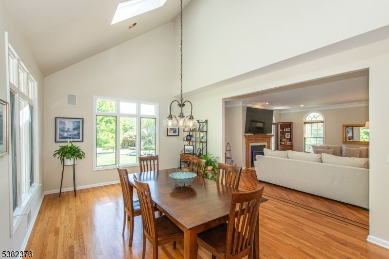 Dining room, Fireplace, Interior, Living room, Pendant Lights, Recessed Lighting, Wood Texture Flooring