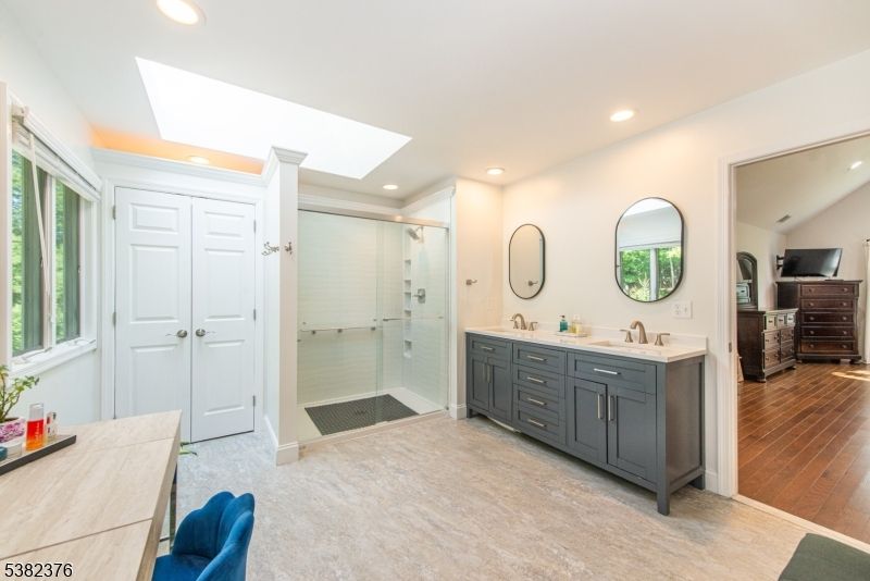 Bathroom, Dual Sink Vanities, Glass Shower, Interior, Recessed Lighting, Wood Texture Flooring