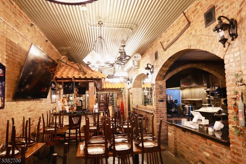 Chandelier, Dining room, Interior, Pendant Lights, Stone Walls