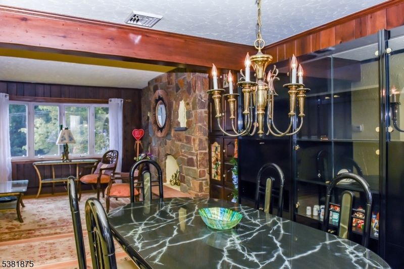 Chandelier, Dining room, Fireplace, Interior, Stone Walls