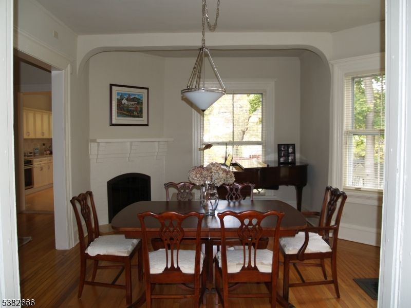 Dining room, Fireplace, Interior, Pendant Lights, Wood Texture Flooring