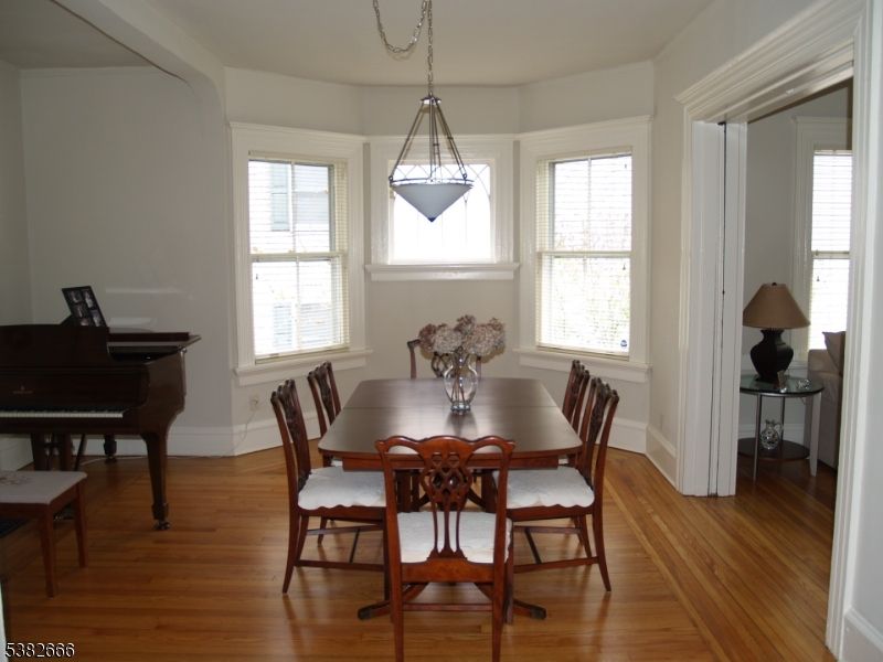 Dining room, Interior, Pendant Lights, Piano, Wood Texture Flooring