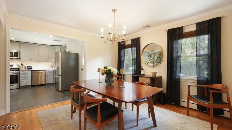 Chandelier, Dining room, Interior, Kitchen, Recessed Lighting, Stainless Steel Appliances, Wood Texture Flooring