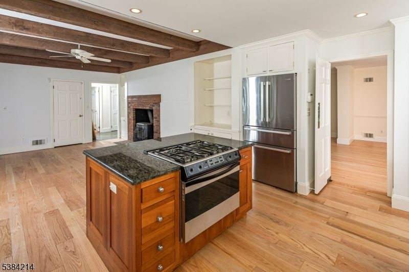 Fireplace, Interior, Kitchen, Recessed Lighting, Stainless Steel Appliances, Wooden Beams, Wood Texture Flooring
