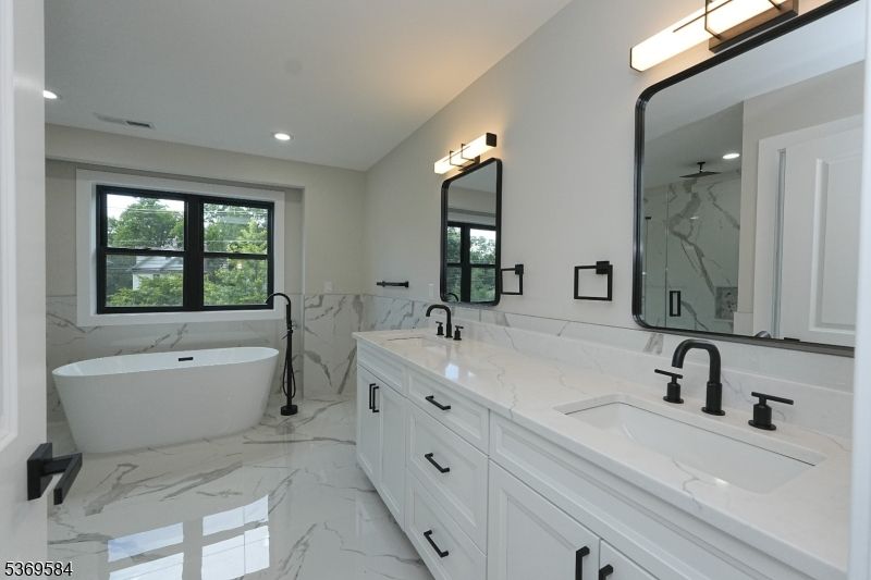 Bathroom, Dual Sink Vanities, Free Standing Baths, Interior, Marble, Marble Walls, Recessed Lighting