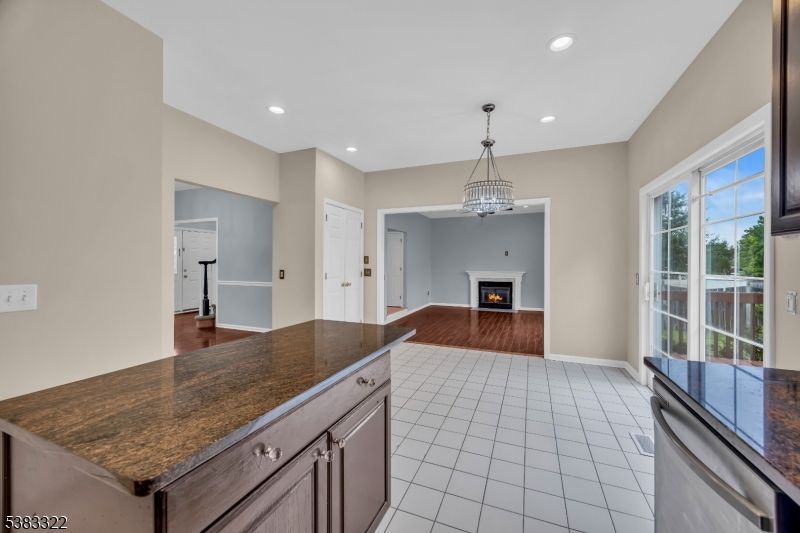 Chandelier, Empty room, Fireplace, Interior, Pendant Lights, Recessed Lighting, Wood Texture Flooring