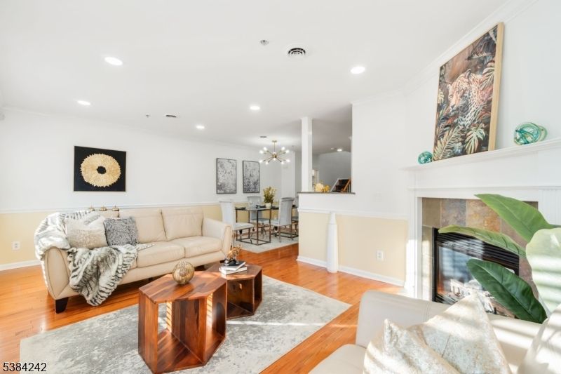 Dining room, Fireplace, Interior, Living room, Pendant Lights, Recessed Lighting, Wood Texture Flooring