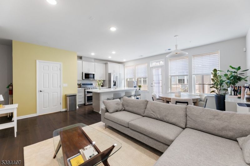 Dining room, Interior, Kitchen, Living room, Pendant Lights, Recessed Lighting, Stainless Steel Appliances, Wood Texture Flooring