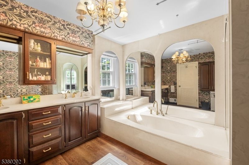 Bathroom, Chandelier, Dual Sink Vanities, Interior, Recessed Lighting, Wood Texture Flooring