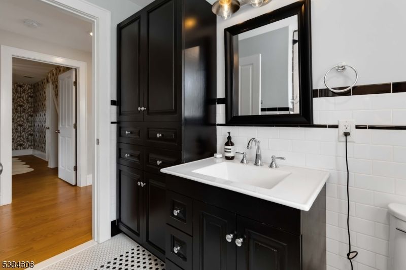 Bathroom, Dual Sink Vanities, Interior, Recessed Lighting, Wood Texture Flooring